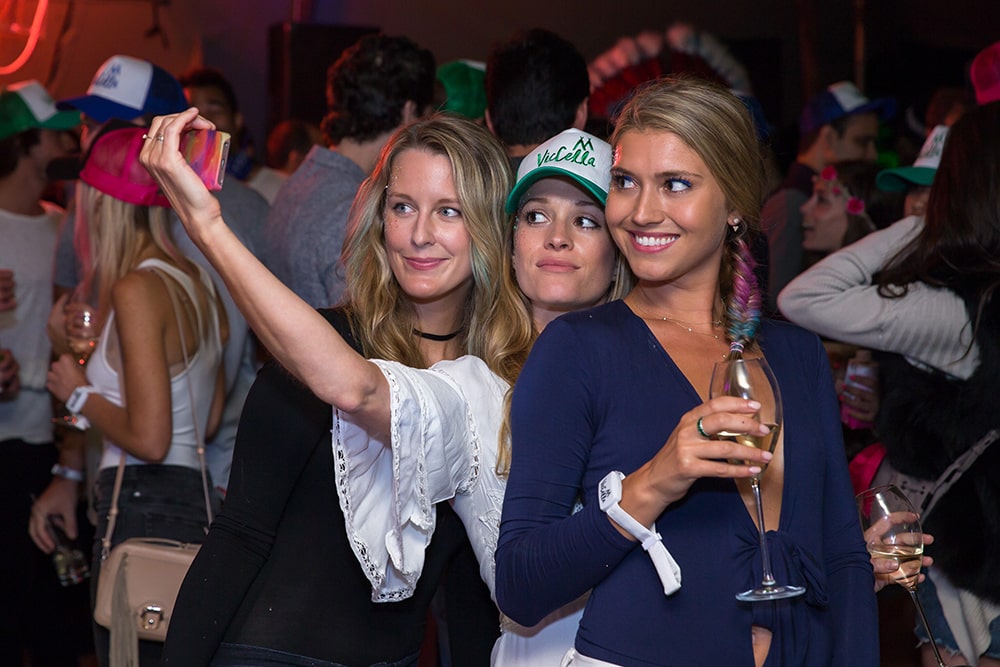 Three ladies taking a selfie at a party